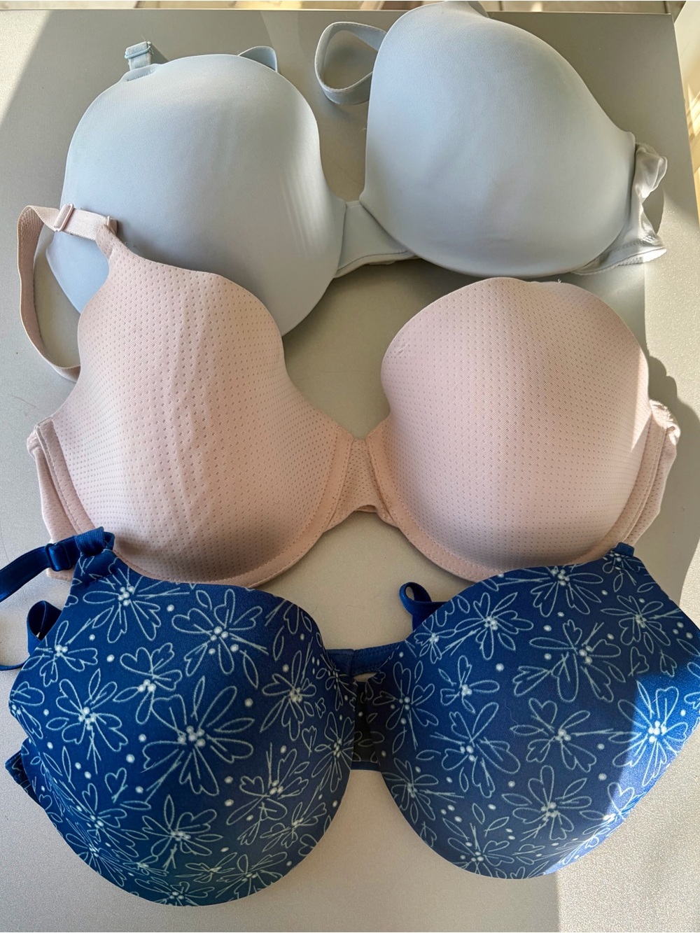 Warner's Trio Bra Set in Blue, Blush & Navy Floral. All are 34D.